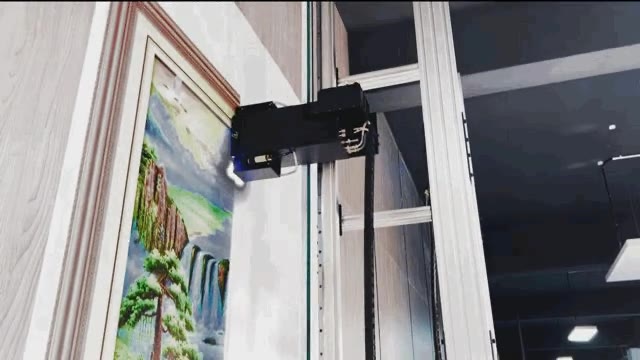 Dual UV curing lamps on the print head carriage beside a framed landscape printed directly on a wall