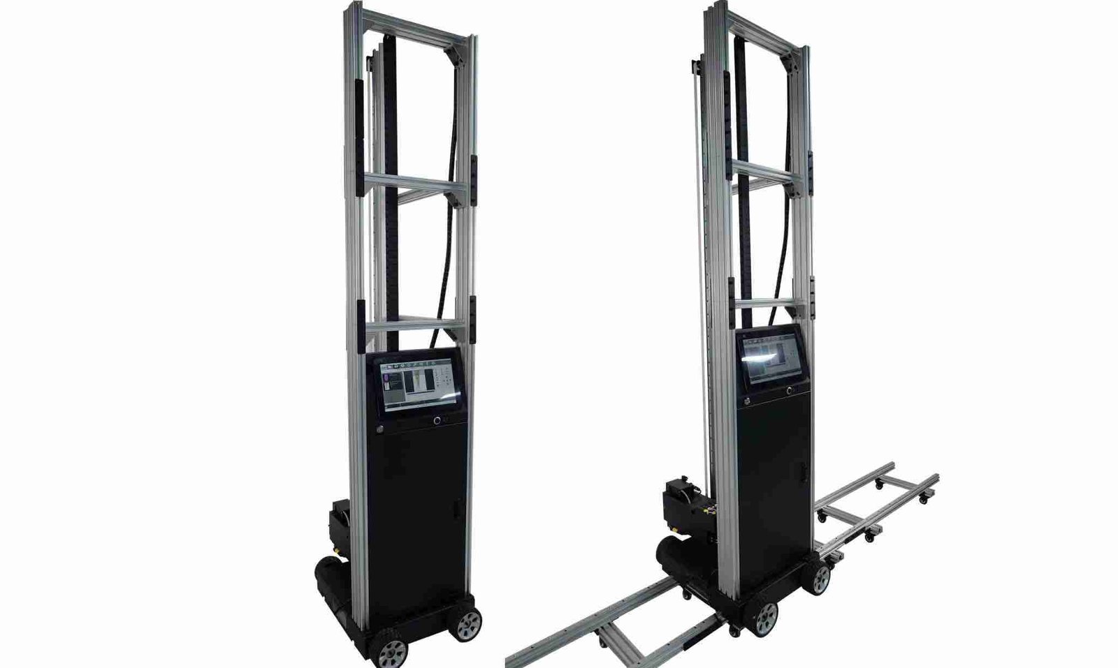 The drive wheels of the printer seated on the horizontal aluminum rails