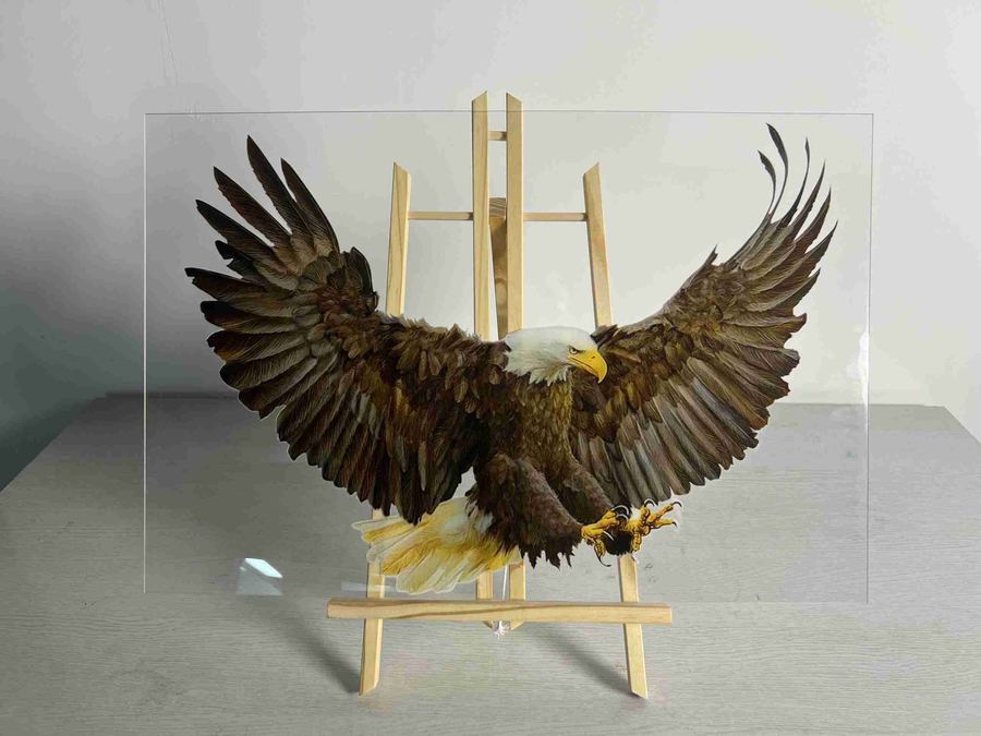 A printed eagle on clear acrylic, displayed on an easel